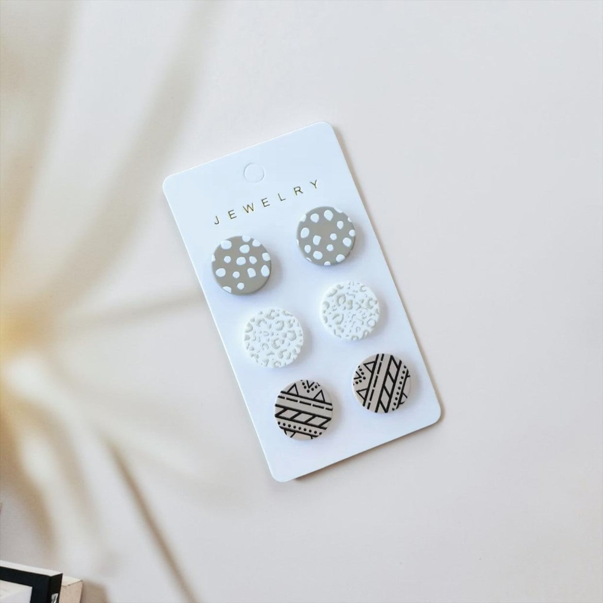 Boucle d'oreille (boutons)