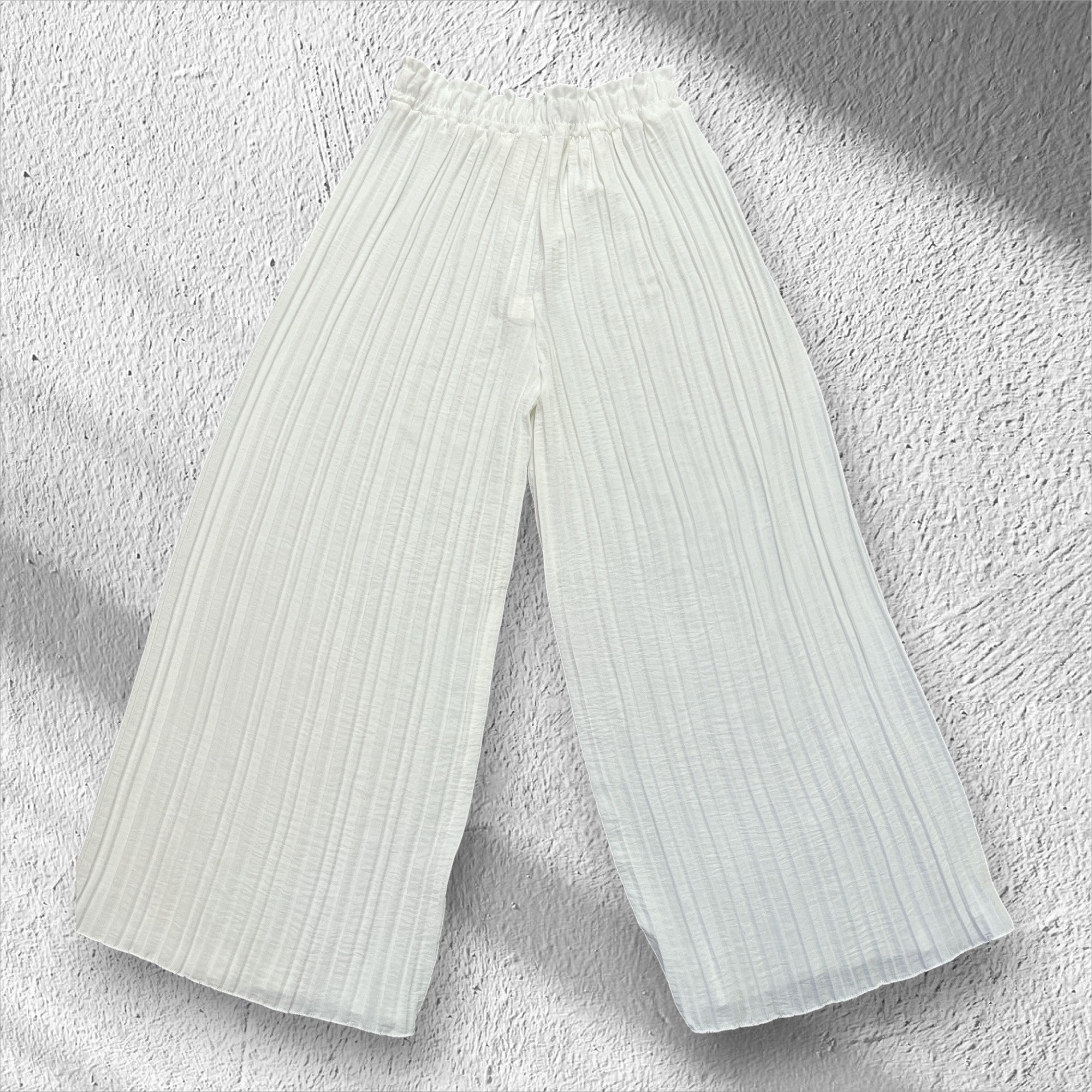 Pantalons à plis