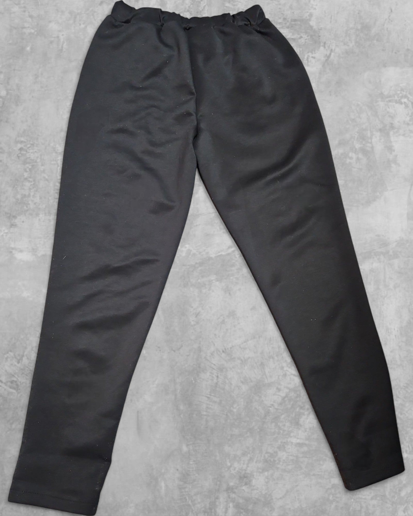 Pantalon avec bandes brillantes sur les poches