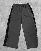 Pantalon avec bandes brillantes sur les côtés