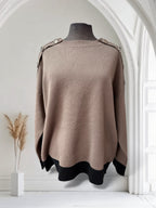 Chandail avec boutons sur les épaules