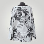 Blouse Boutique Sylbelle en lin et viscose à imprimé floral noir et blanc, manches longues, col bateau.