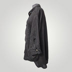Boutique Sylbelle Top noir en lin 100% naturel, col chemise, manches courtes retroussées avec bouton, coupe ample et respirante.