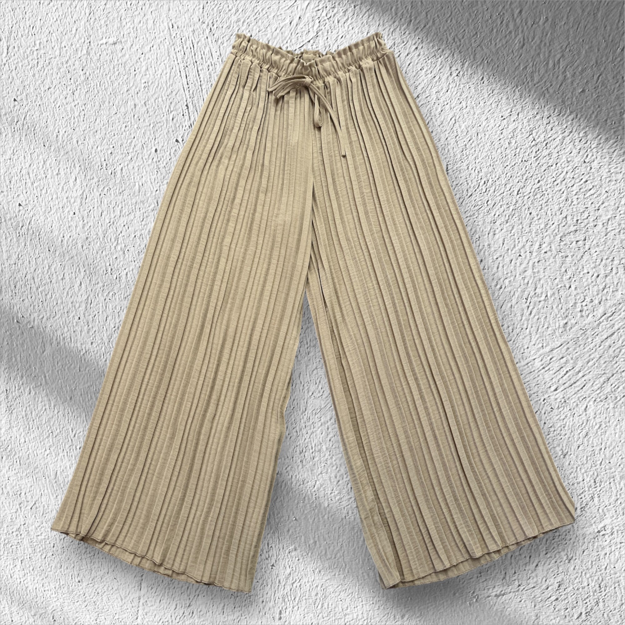 Pantalons à plis